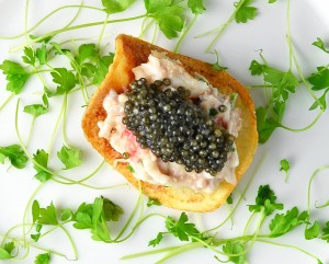 Signature Russian Amuse-Bouche: Potato Chip, King Crab, Brains, and Caviar