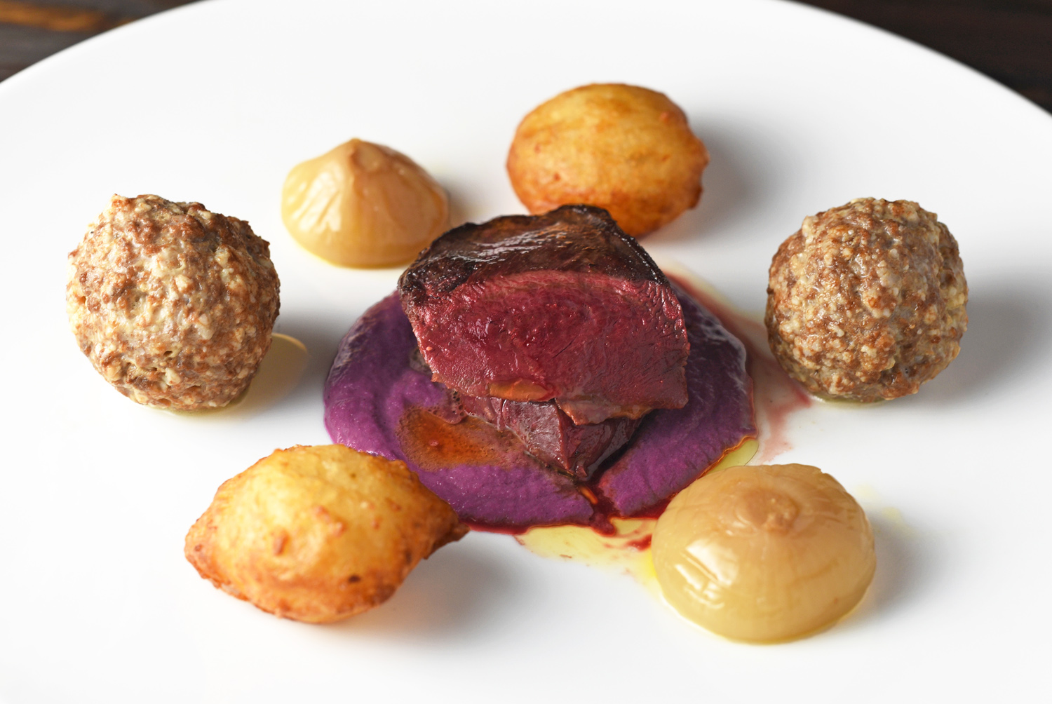 Duck Breast And Meatballs, Potato Croquettes, Caramelized Onions. and Red Cabbage Purée